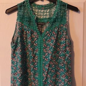 Multi colored tank top with lace accents.